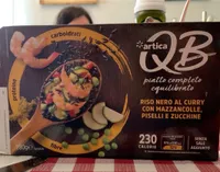 Riso nero al curry con mazzancolle, piselli e zucchine