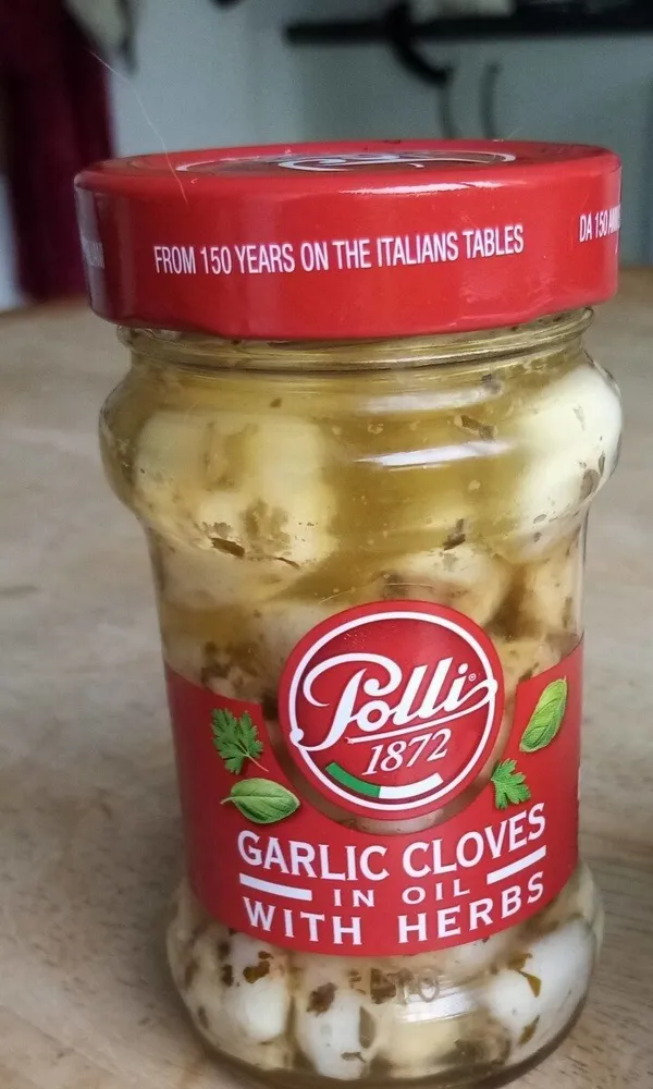 Garlic cloves in oil with herbs