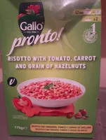 Risotto with tomato, carrot and grain or hazelnuts