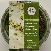 Dessert cioccolato bianco e pistacchio con granella di pistacchio