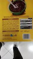 Copos de maíz laminados y tostados, recubiertos de chocolate negro