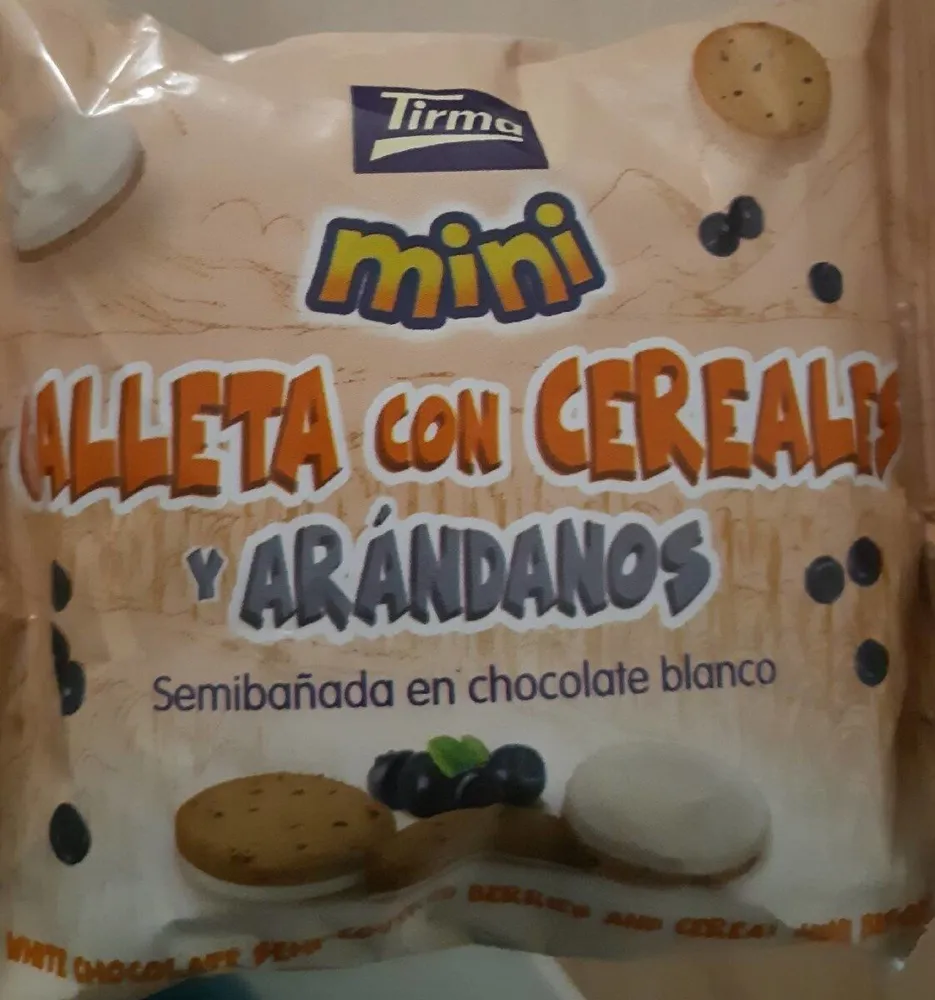 Mini galleta con cereales y arándanos semibañada en chocolate blanco