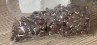 Cacahuètes grillées enrobées de chocolat noir