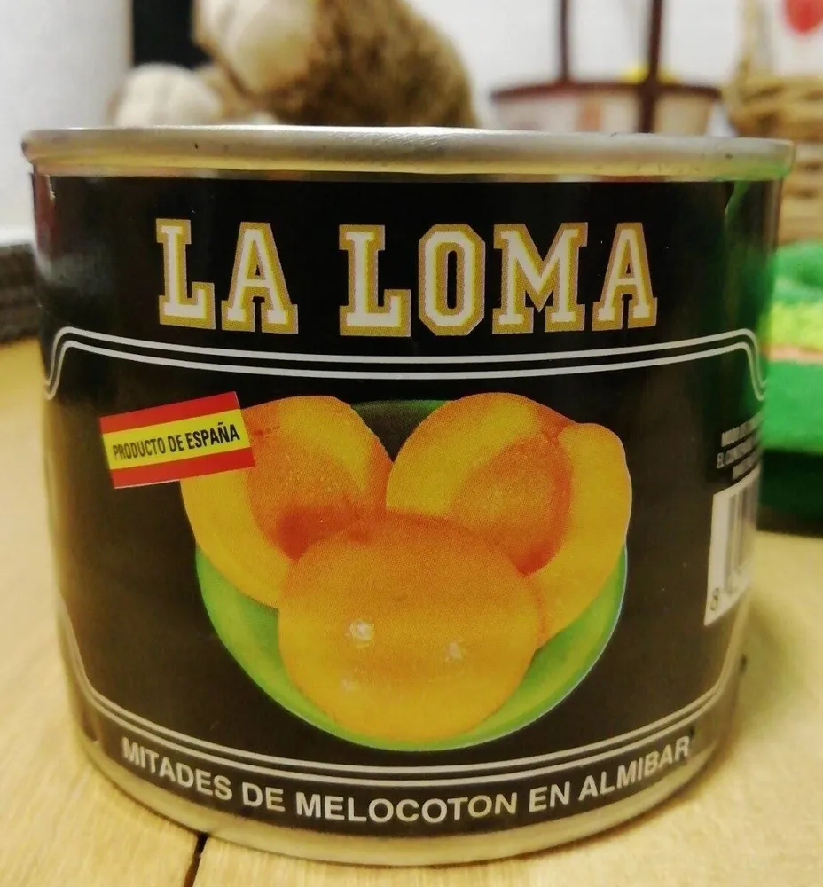 Mitades de melocoton en almibar