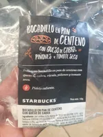 Bocadillo en pan de centeno con queso de cabra, piñones y tomate seco