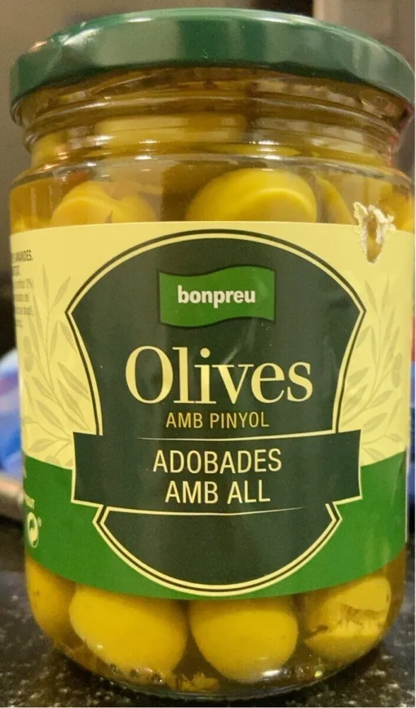 Olives amb pinyol adobades amb all