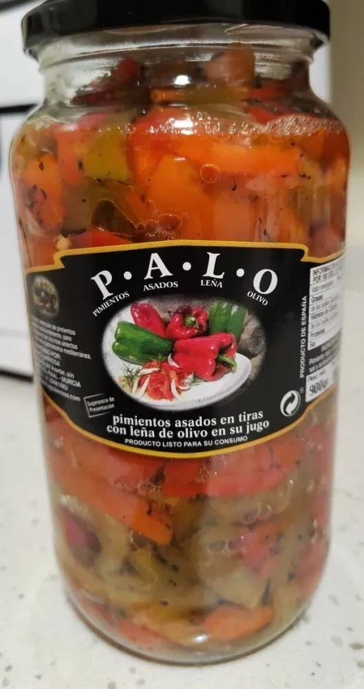 Pimientos asados en tiras con leña de olivo en su jugo