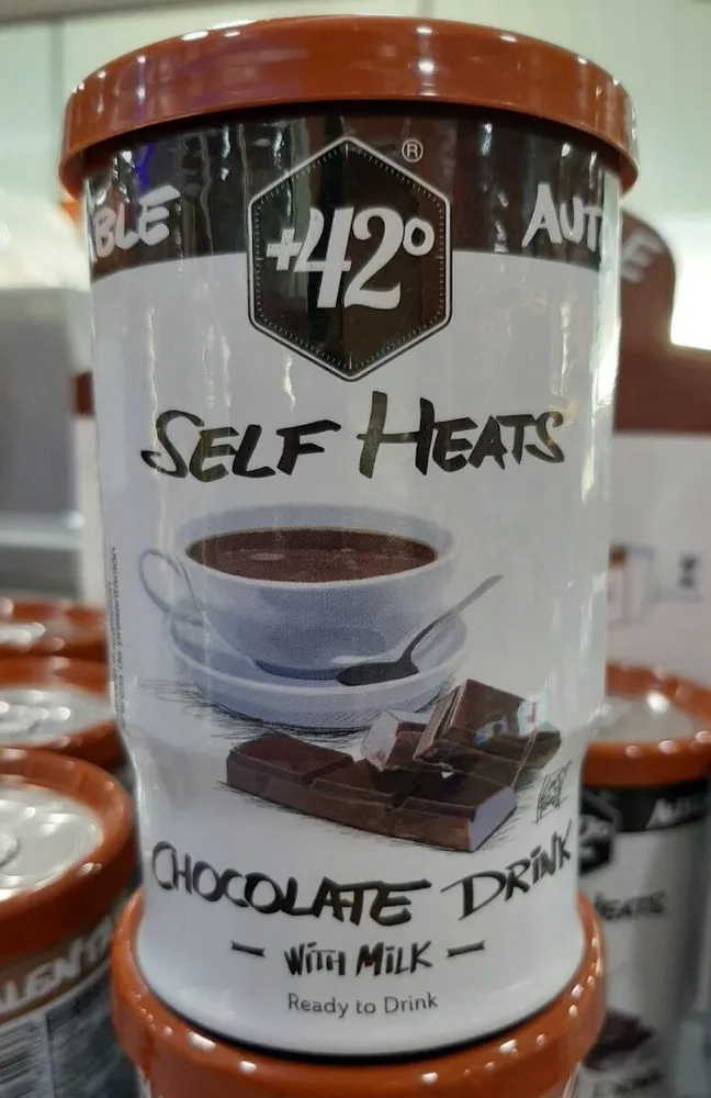 Self heats chocolate drink with milk