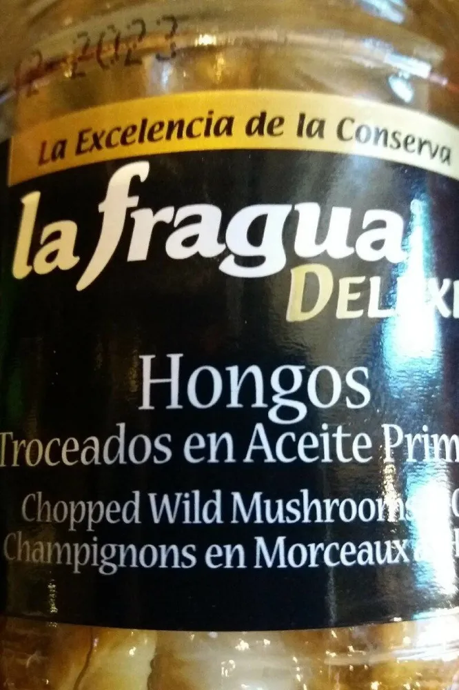Hongos troceados en aceite de primera
