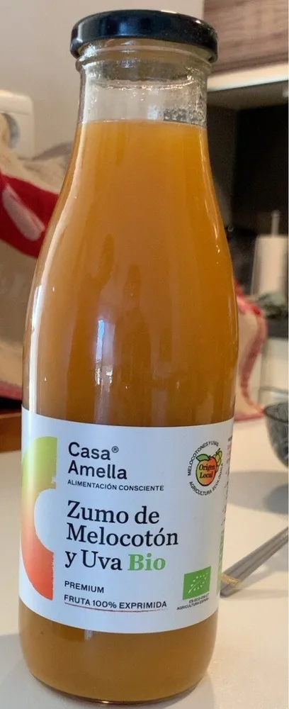 Zumo fe melocotón y uva