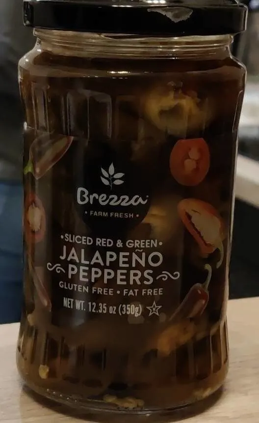 Sliced red and green jalapeno peppers