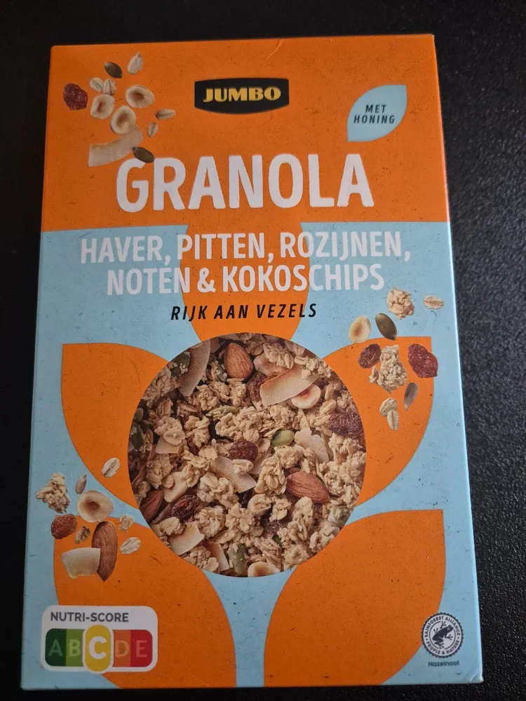 Granola haver, pitten, rozijnen, noten & kokoschips met honing
