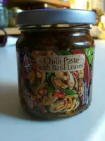 Chili past with basil leaves