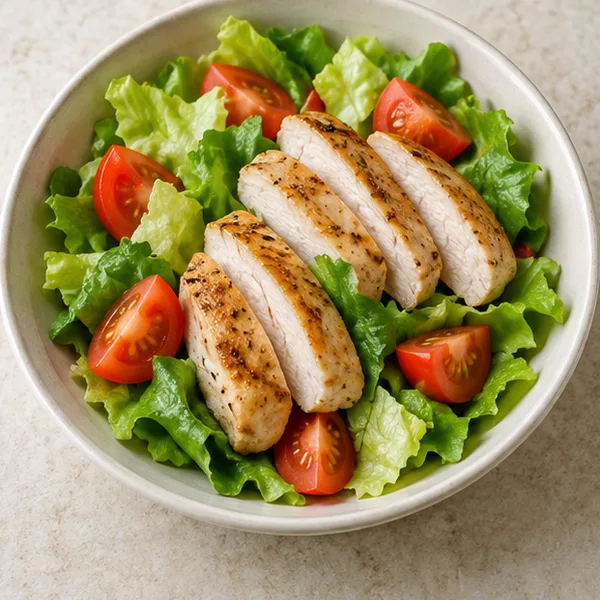 Illustration of chicken breast salad with lettuce and tomato