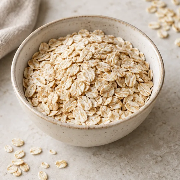 Illustration of dry rolled oats in a bowl